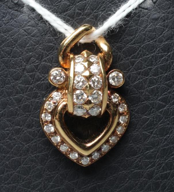 A DIAMOND OPEN HEART PENDANT, point set with numerous small stones to a fixed mount and plain bale, Image