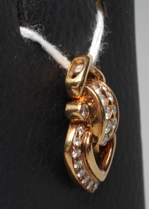 A DIAMOND OPEN HEART PENDANT, point set with numerous small stones to a fixed mount and plain bale, Image