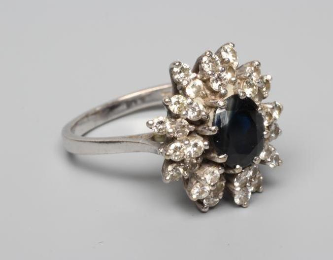 A SAPPHIRE AND DIAMOND CLUSTER RING Image