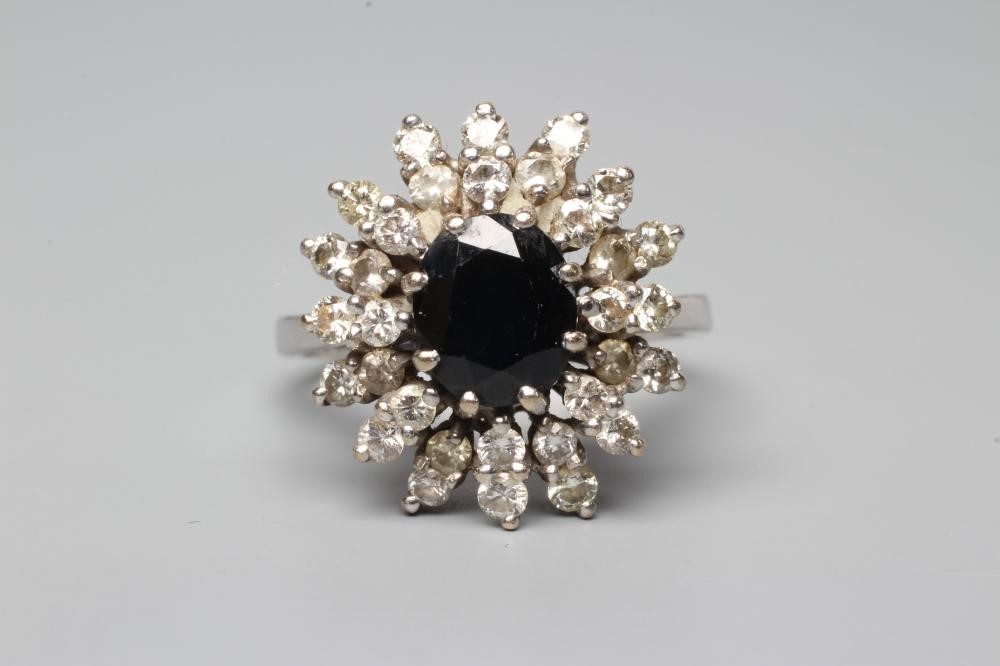 A SAPPHIRE AND DIAMOND CLUSTER RING Image
