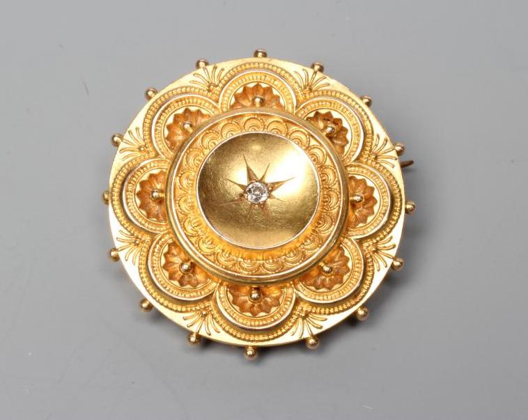 A LATE VICTORIAN 15CT GOLD BOSS BROOCH centred by a small old brilliant cut diamond, Birmingham 1889 Image