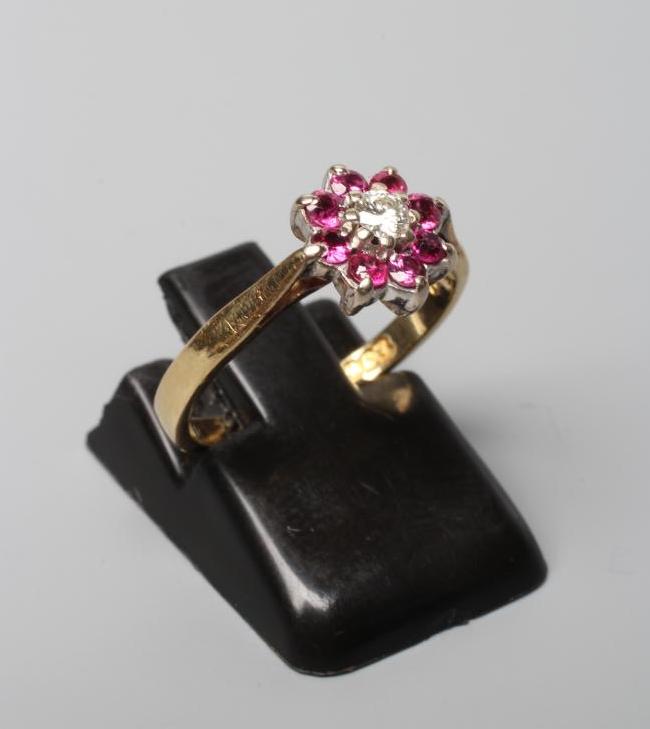 A RUBY AND DIAMOND CLUSTER RING Image