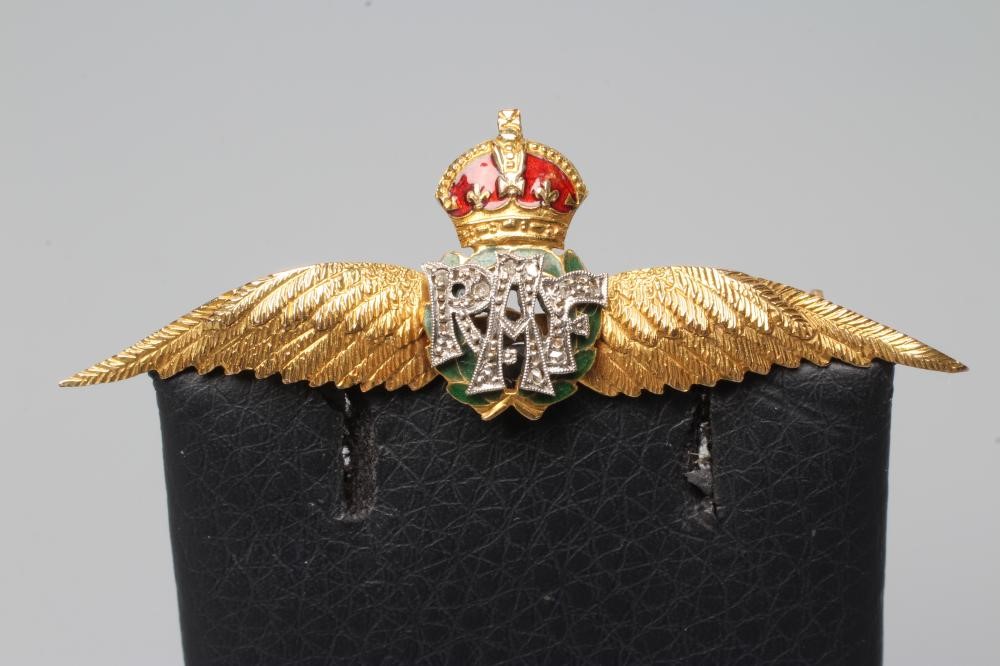 A DIAMOND AND ENAMEL RAF WINGS BROOCH, the rose cut diamond RAF motif below a red enamelled crown Image