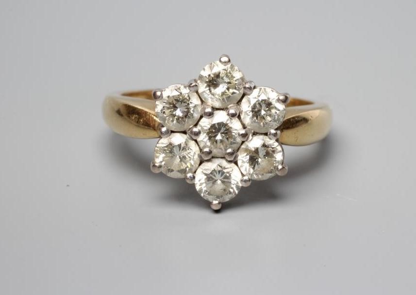 A SEVEN STONE DIAMOND CLUSTER RING, the round brilliant cut stones all of approximately 0.25cts, Image