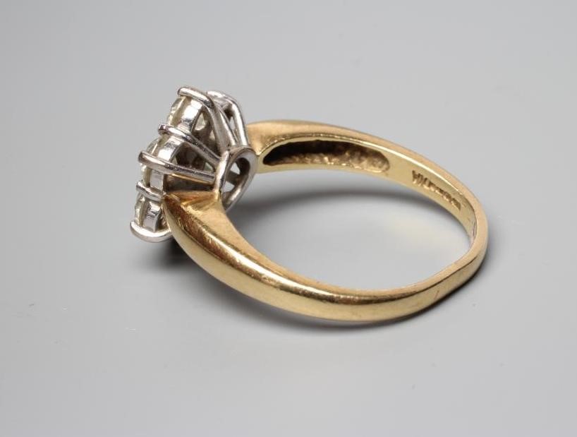 A SEVEN STONE DIAMOND CLUSTER RING, the round brilliant cut stones all of approximately 0.25cts, Image