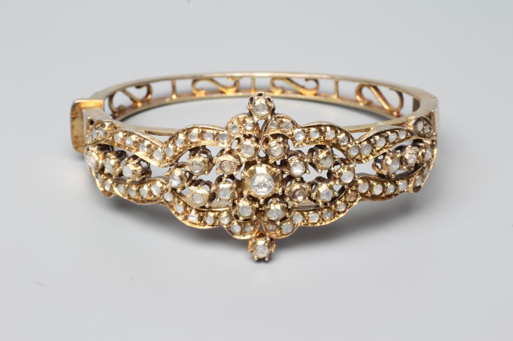 A DIAMOND STIFF HINGED BANGLE Image