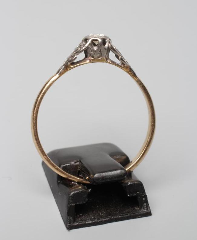 A SOLITAIRE DIAMOND RING, the old cut stone of approximately 0.20cts, illusion set to open white Image
