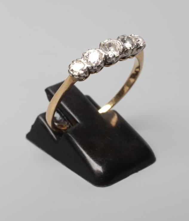 A FIVE STONE DIAMOND HALF HOOP RING, the old cut stones claw set to a plain unmarked shank, size U Image