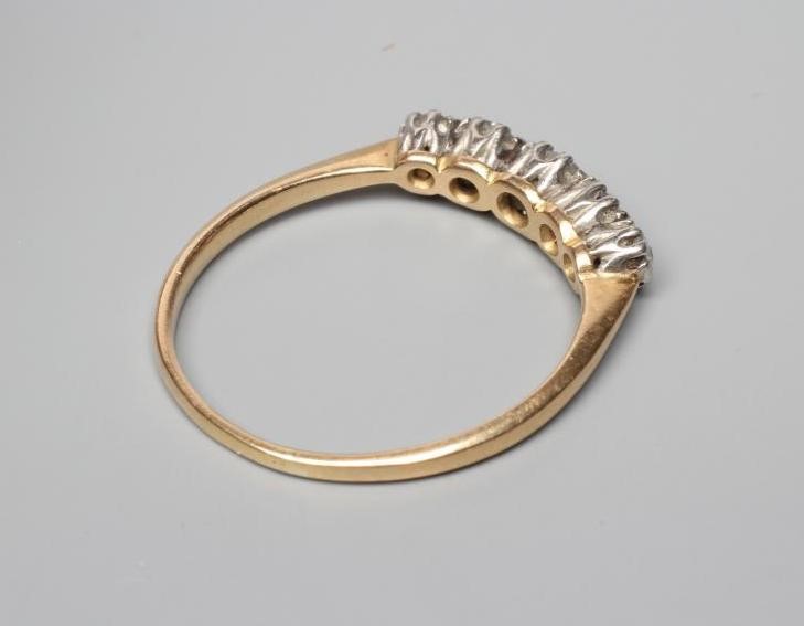 A FIVE STONE DIAMOND HALF HOOP RING, the old cut stones claw set to a plain unmarked shank, size U Image