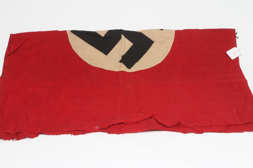 A GERMAN THIRD REICH FLAG of typical form with red ground and central swastika, one sided, 38" x 28 Image
