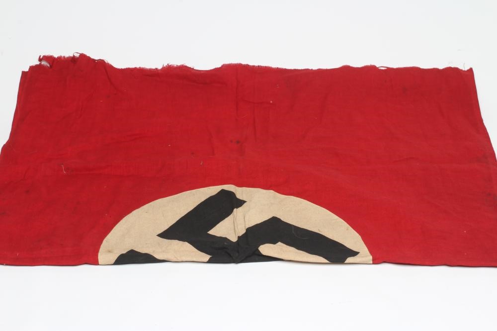 A GERMAN THIRD REICH FLAG of typical form with red ground and central swastika, one sided, 38" x 28 Image