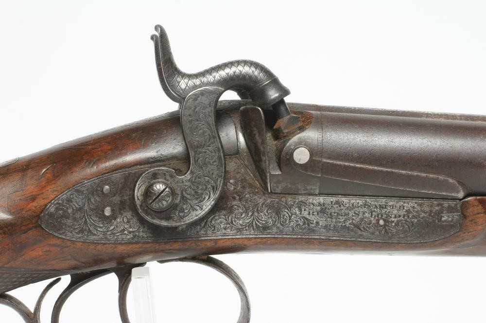 A PERCUSSION DOUBLE BARRELLED SHOTGUN Image