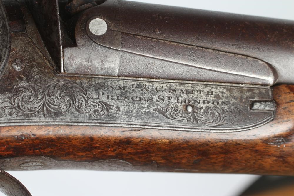 A PERCUSSION DOUBLE BARRELLED SHOTGUN Image