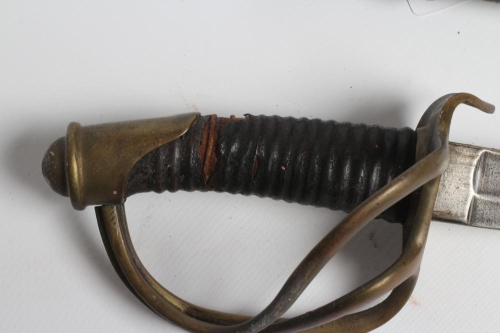 A FRENCH CAVALRY SABRE, possible US civil war import, with 35 1/2" curved and fullered blade, brass Image