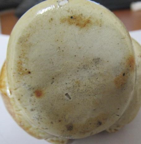 A VICTORIAN STONEWARE NOVELTY INKWELL modelled as Mr Pickwick with a quill hole to each shoulder Image