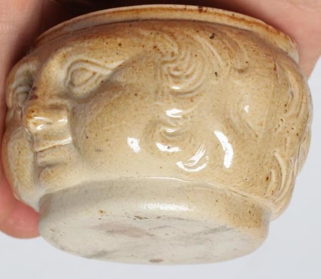 A VICTORIAN STONEWARE NOVELTY INKWELL modelled as Mr Pickwick with a quill hole to each shoulder Image