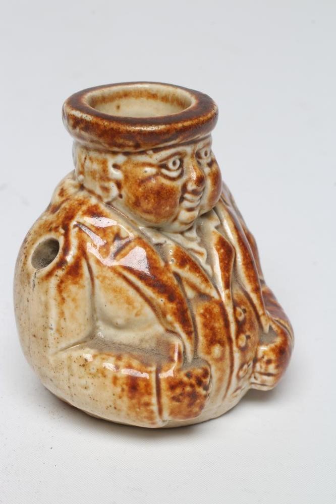 A VICTORIAN STONEWARE NOVELTY INKWELL modelled as Mr Pickwick with a quill hole to each shoulder Image