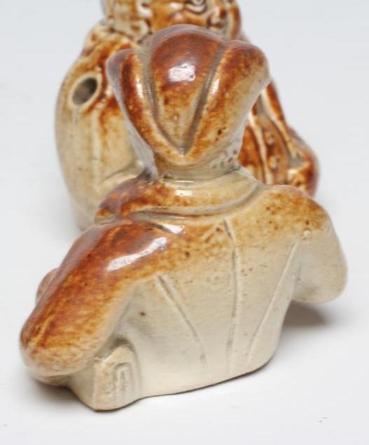A VICTORIAN STONEWARE NOVELTY INKWELL modelled as Mr Pickwick with a quill hole to each shoulder Image