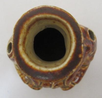 A VICTORIAN STONEWARE NOVELTY INKWELL modelled as Mr Pickwick with a quill hole to each shoulder Image