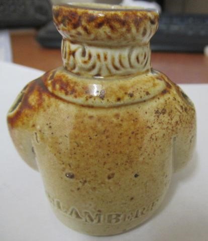 A VICTORIAN STONEWARE NOVELTY INKWELL modelled as Mr Pickwick with a quill hole to each shoulder Image