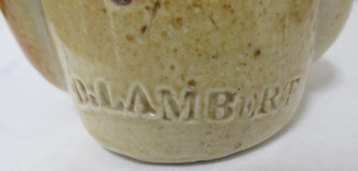 A VICTORIAN STONEWARE NOVELTY INKWELL modelled as Mr Pickwick with a quill hole to each shoulder Image