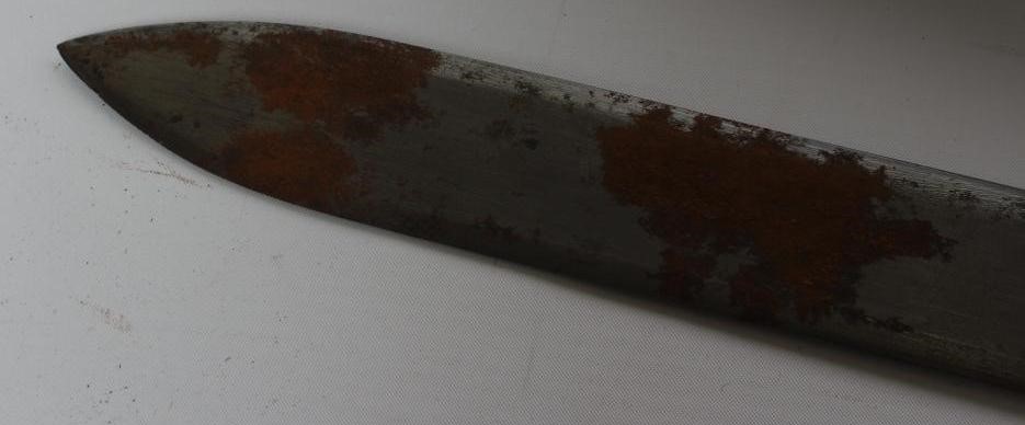 A SUDANESE KASKARA SWORD, the 34 1/2" blade etched with script and repeating designs, cruciform Image