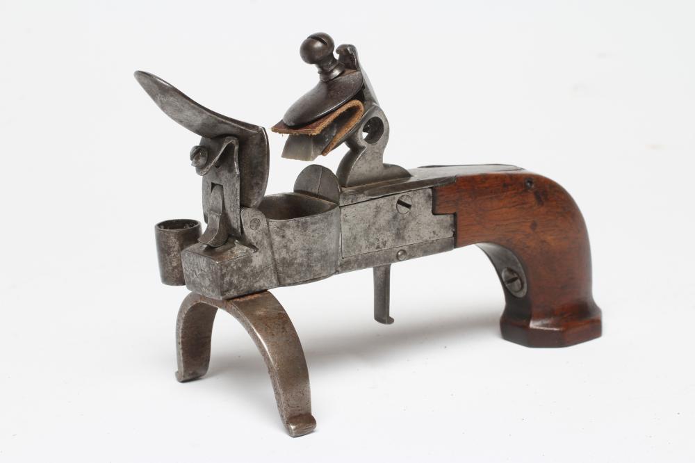 A FLINTLOCK TINDER BOX PISTOL, 19th century, with large pan, box lock action and walnut grip, 5 3/4" Image
