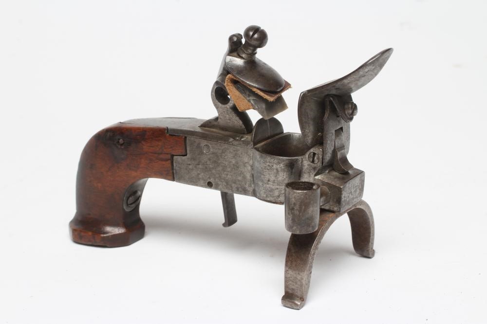 A FLINTLOCK TINDER BOX PISTOL, 19th century, with large pan, box lock action and walnut grip, 5 3/4" Image
