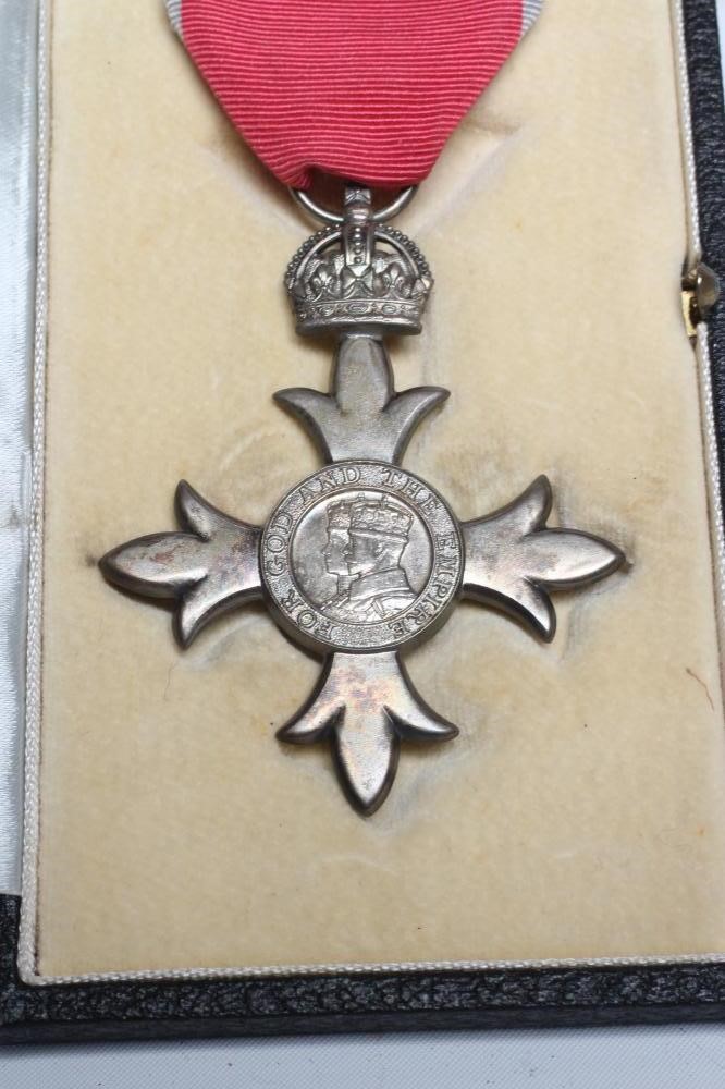 A GEORGE VI M.B.E. with red ribbon, boxed, un-named (Est. plus 24% premium inc. VAT) Image