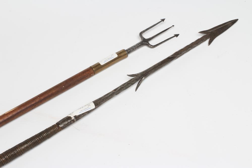 TWO TRIBAL FISHING SPEARS, one with barbed tip and original shaft with weighted wrappings, the other Image
