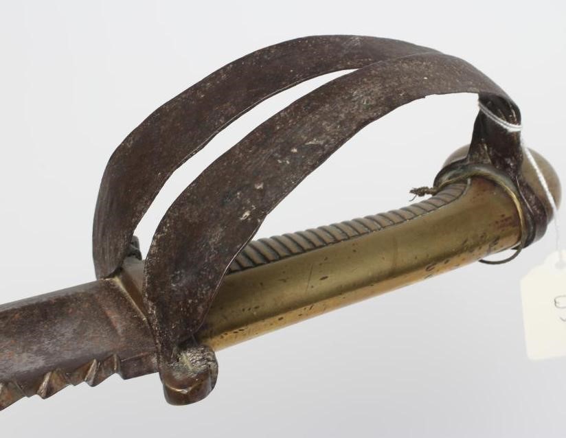 A RUSSIAN 1827 PATTERN PIONEER SHORT SWORD with 19 1/2" saw back blade, brass hilt with contemporary Image