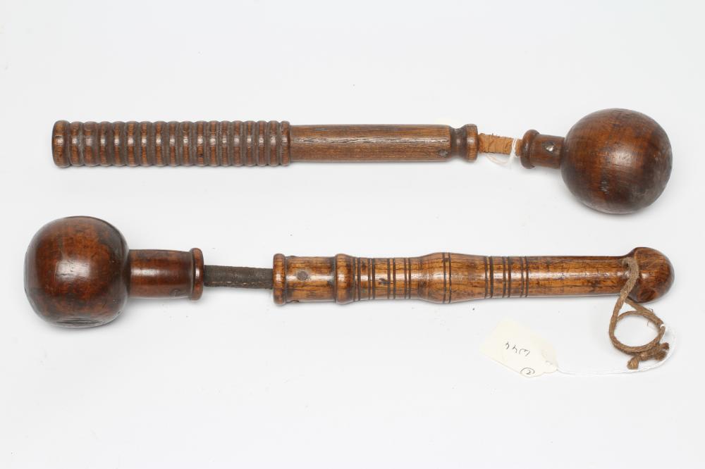A BOATSWAIN'S KOSH, 19th century, with spherical head, flexible leather link and turned grip, Image