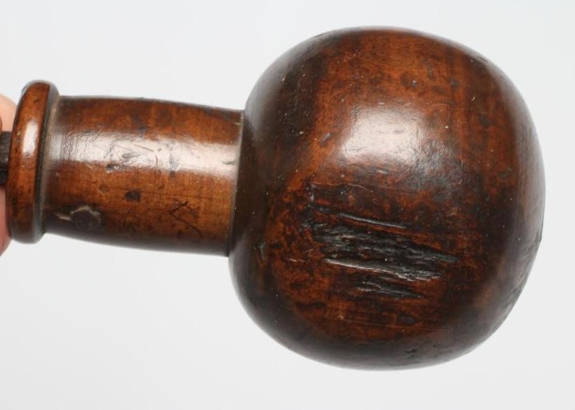 A BOATSWAIN'S KOSH, 19th century, with spherical head, flexible leather link and turned grip, Image