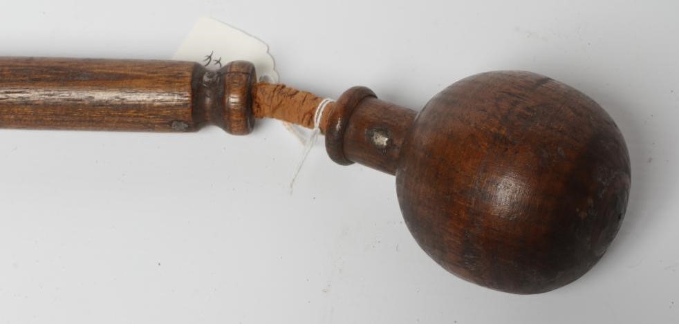 A BOATSWAIN'S KOSH, 19th century, with spherical head, flexible leather link and turned grip, Image