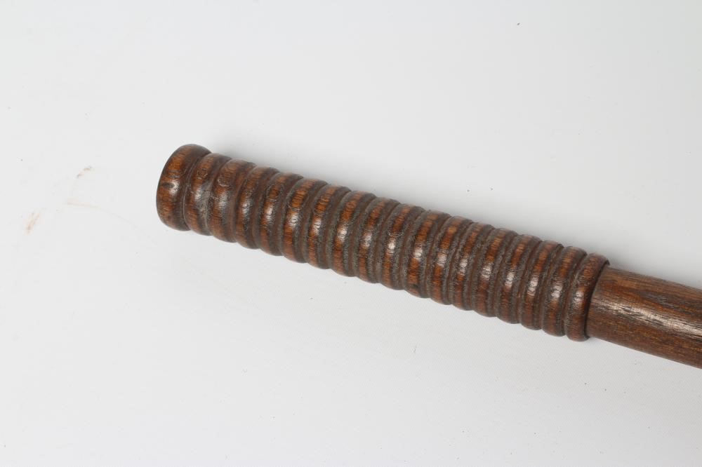 A BOATSWAIN'S KOSH, 19th century, with spherical head, flexible leather link and turned grip, Image