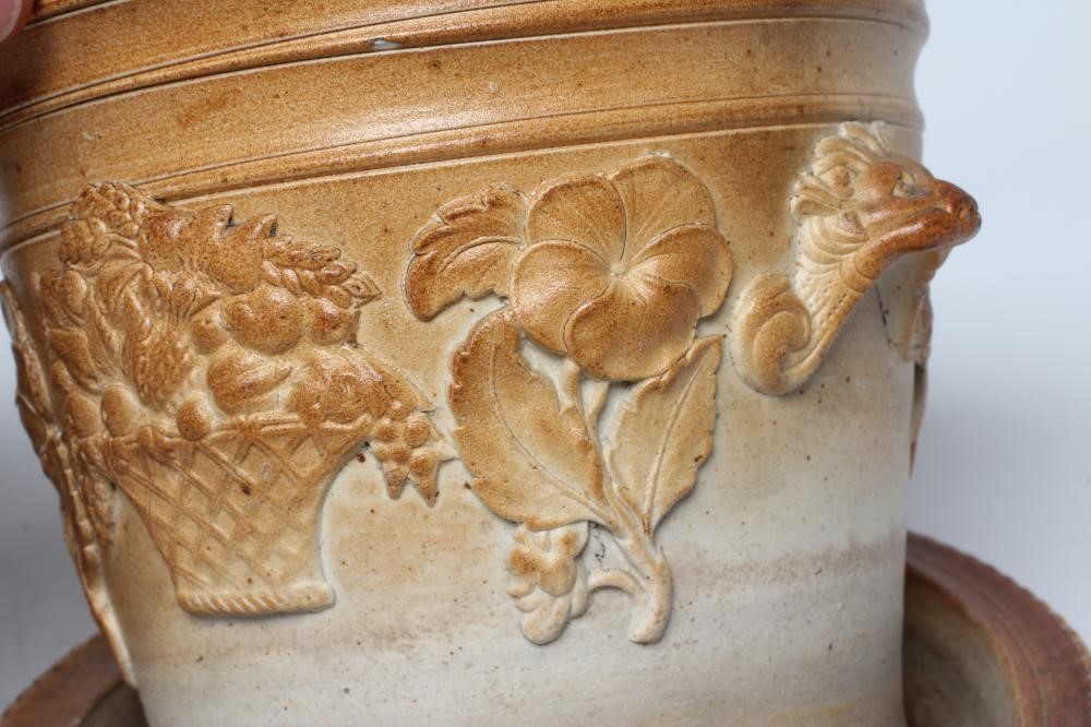 A SALTGLAZE STONEWARE CACHE-POT AND STAND Image