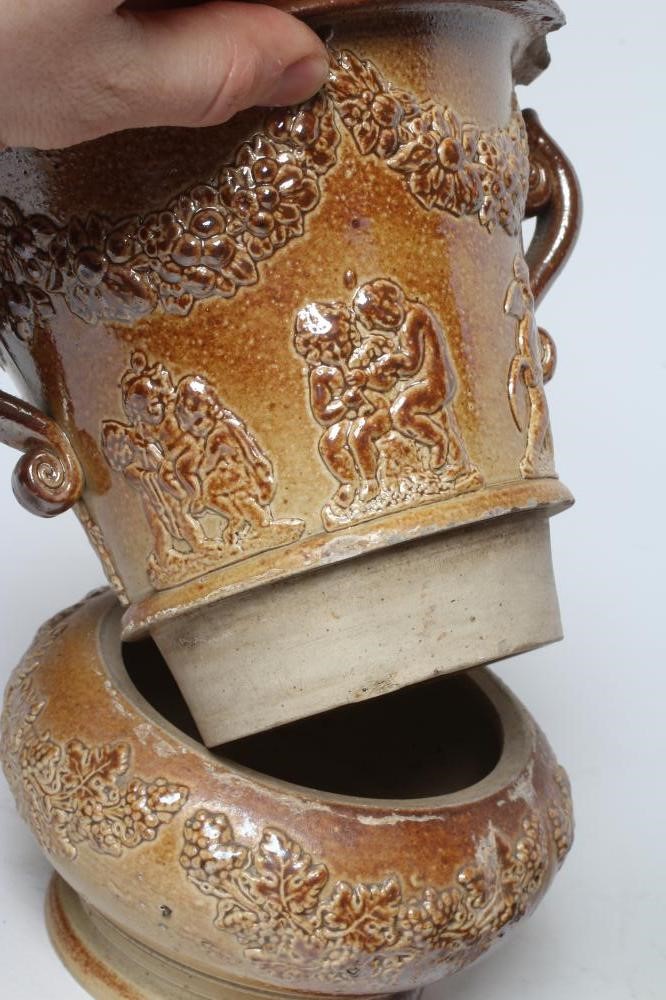 A SALTGLAZE STONEWARE CACHE-POT AND STAND Image