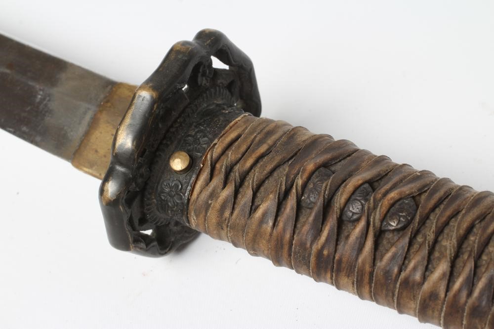A JAPANESE WWII OFFICER'S KATANA, with 26 3/4" curved blade, military mounts, leather wrapped grip Image