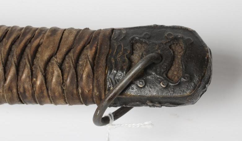 A JAPANESE WWII OFFICER'S KATANA, with 26 3/4" curved blade, military mounts, leather wrapped grip Image