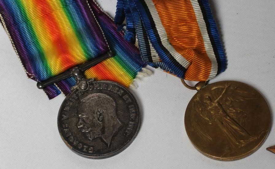 THE MEDALS AND DEATH PLAQUE OF THREE BROTHERS Image