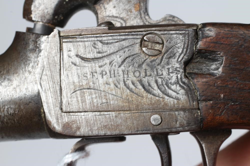A PERCUSSION POCKET PISTOL by Joseph Hollis, with 1 3/4" barrel, etched action and walnut slab grip, Image
