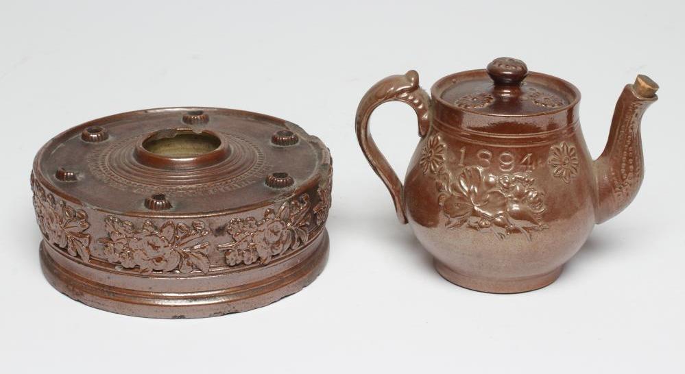 A DOCUMENTARY BROWN SALTGLAZE STONEWARE CIRCULAR INKWELL Image