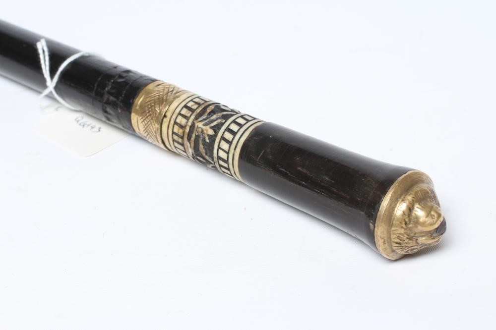 AN INDIAN SWORD STICK with 21" blade, carved bone ferrule and lion mask pommel, 35 3/4" long (Est. Image