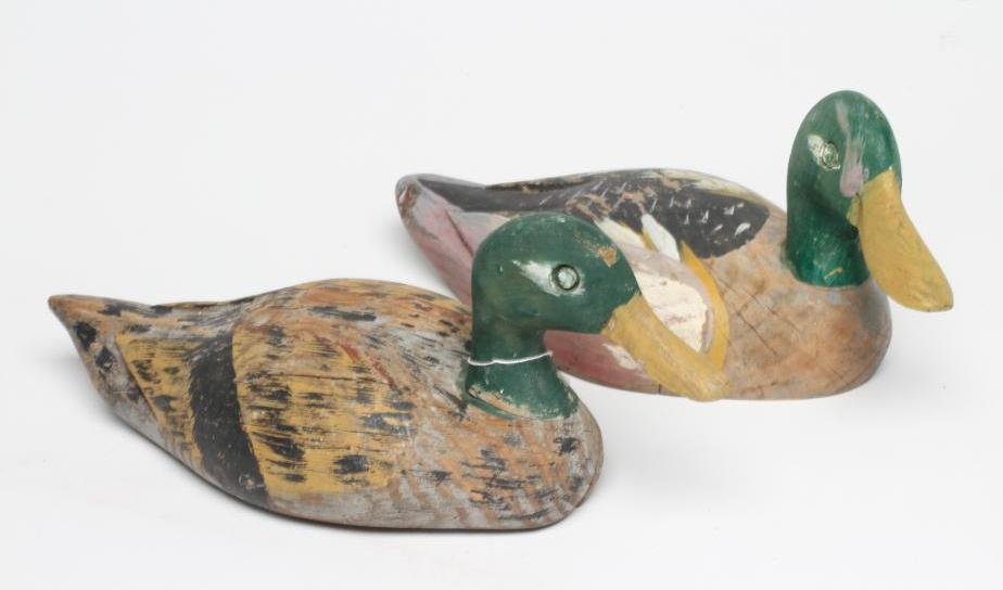 TWO DUCK DECOYS, early 20th century, possibly American, with painted exterior and flat base, largest Image