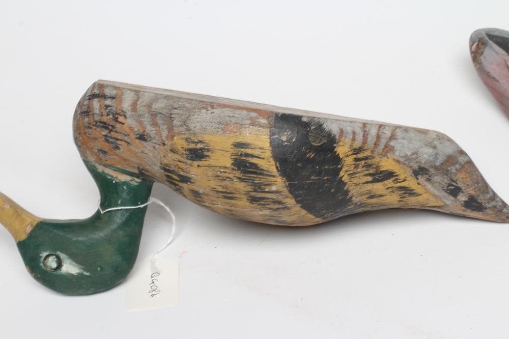 TWO DUCK DECOYS, early 20th century, possibly American, with painted exterior and flat base, largest Image