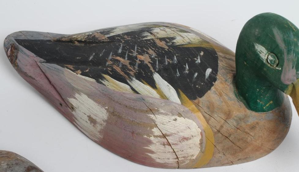 TWO DUCK DECOYS, early 20th century, possibly American, with painted exterior and flat base, largest Image