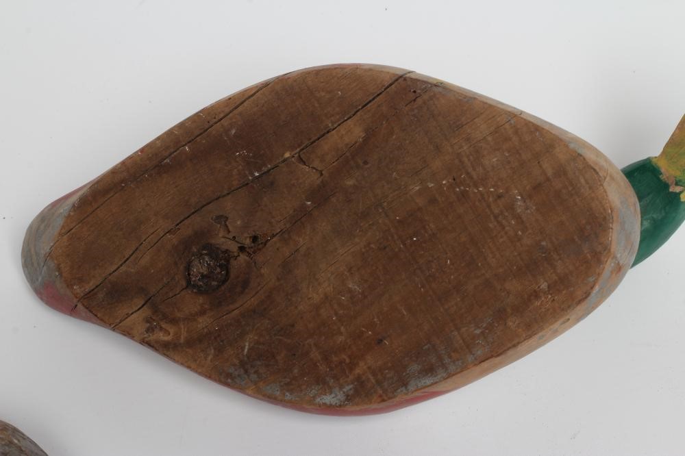 TWO DUCK DECOYS, early 20th century, possibly American, with painted exterior and flat base, largest Image