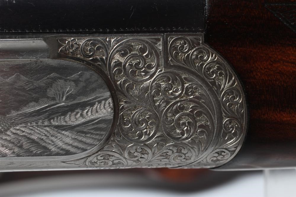 A PAIR OF ALEX MARTIN OVER & UNDER 12 BORE SHOTGUNS Image