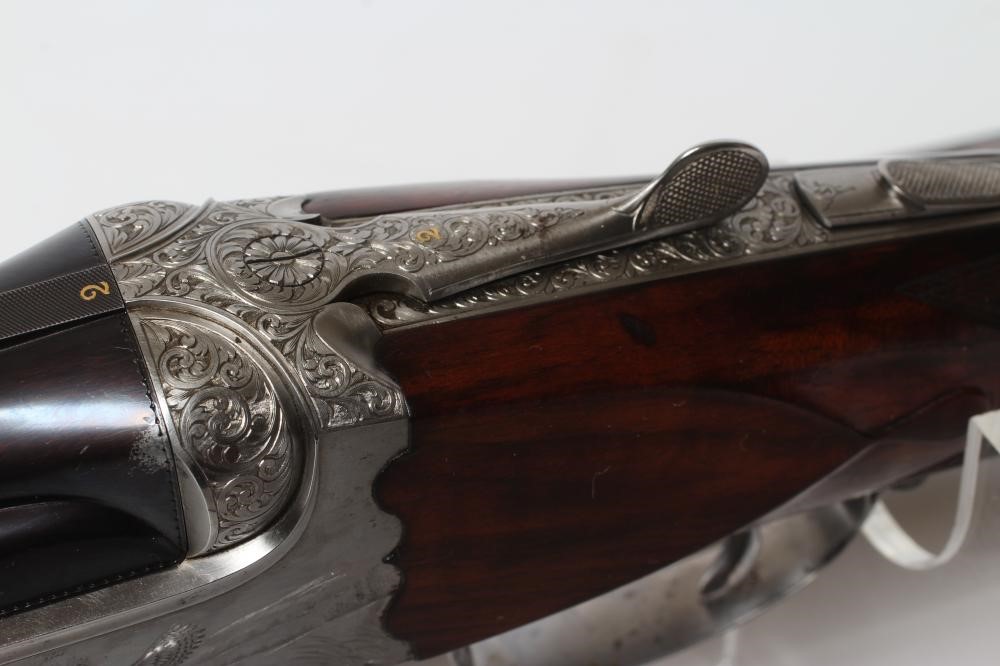 A PAIR OF ALEX MARTIN OVER & UNDER 12 BORE SHOTGUNS Image