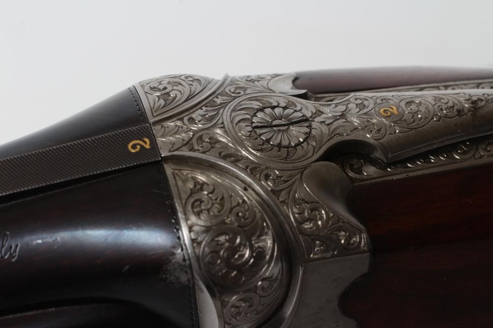 A PAIR OF ALEX MARTIN OVER & UNDER 12 BORE SHOTGUNS Image